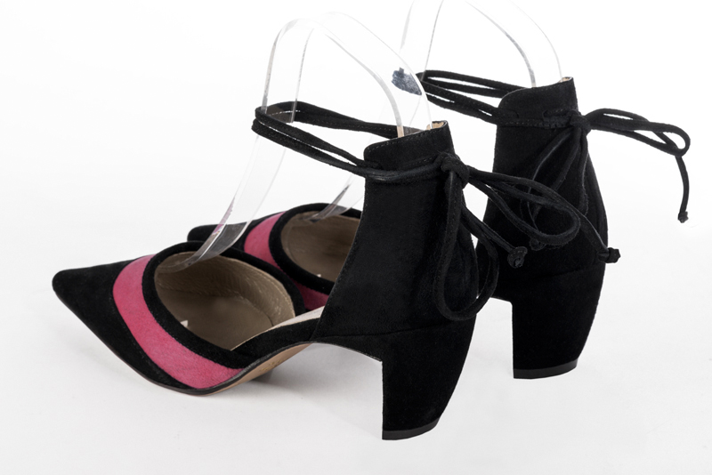 Matt black and shocking pink women's open side shoes, with lace straps. Pointed toe. Medium comma heels. Rear view - Florence KOOIJMAN